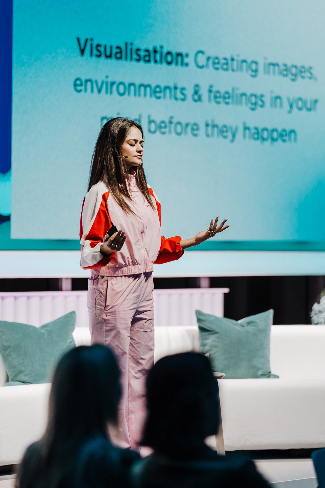 Maya Raichoora leading a visualisation exercise on stage